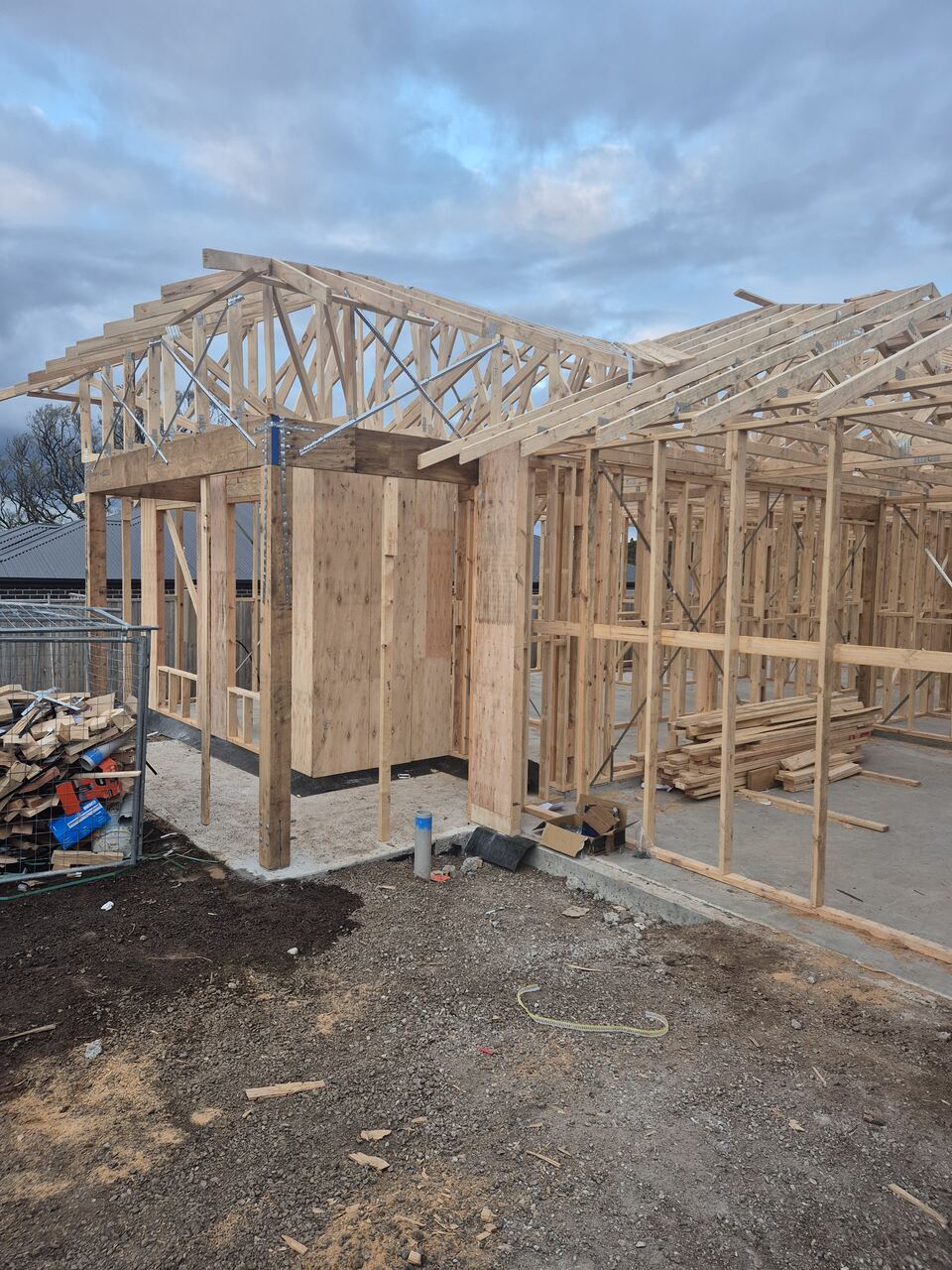 Timber wall frames and roof trusses standing at Ladhams Way